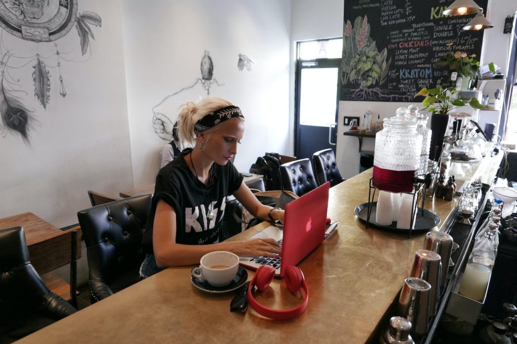 female entrepreneur working in cafe